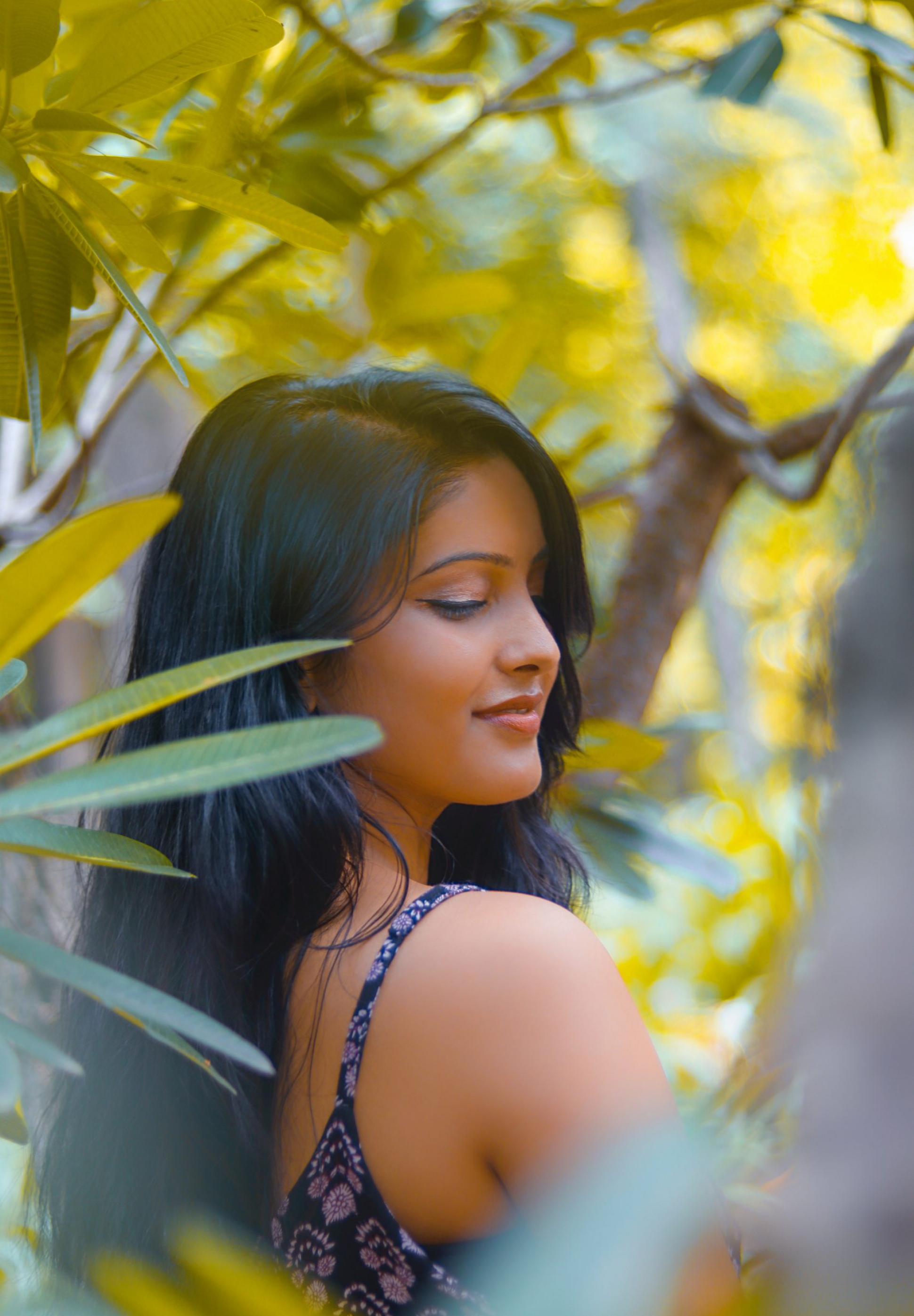 woman-standing-behind-trees-2913125
